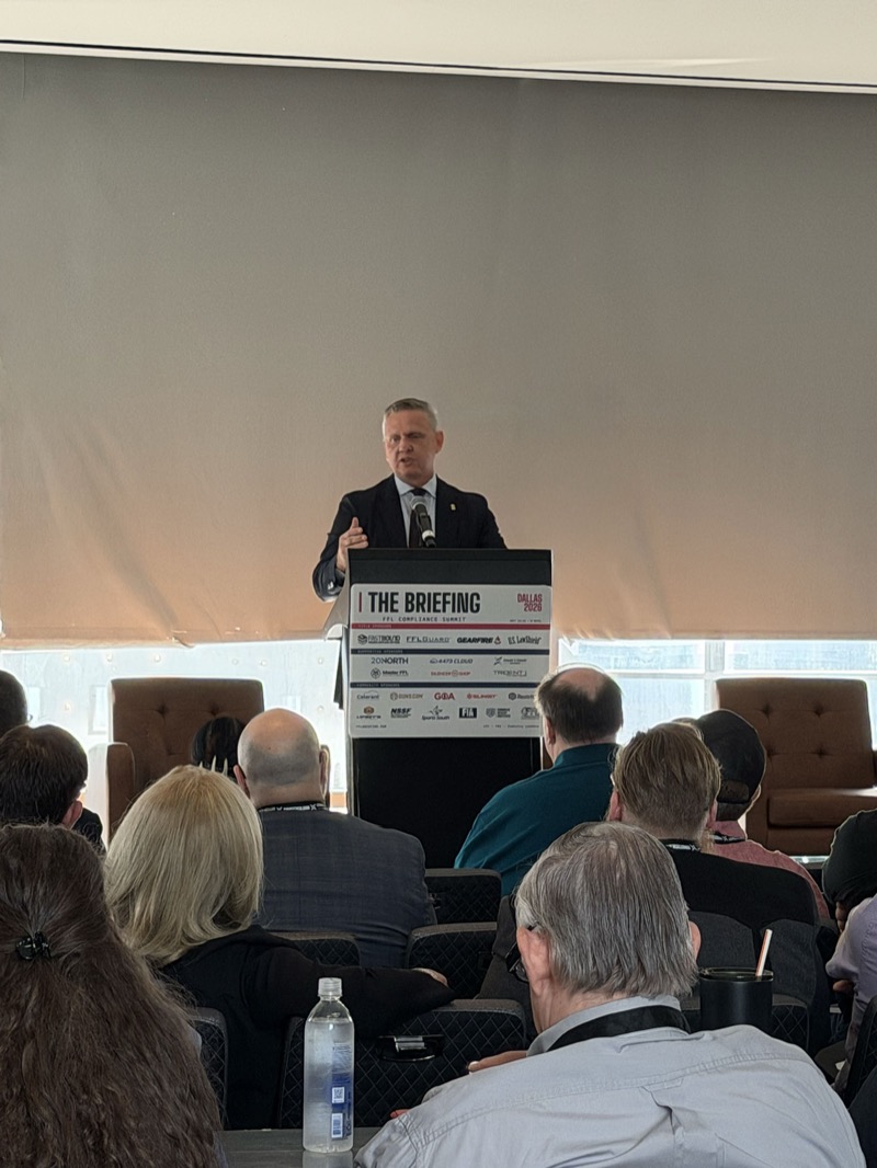 ATF Director Rob Cekada speaking from The Briefing podium during his keynote, “The New Era of FFL Compliance,” with the audience in the foreground